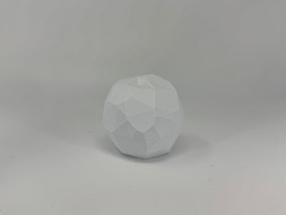 Faceted white planar apple with a short stem
