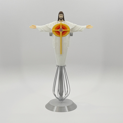 Eggbeater Jesus whisk ornament on the silver display stand