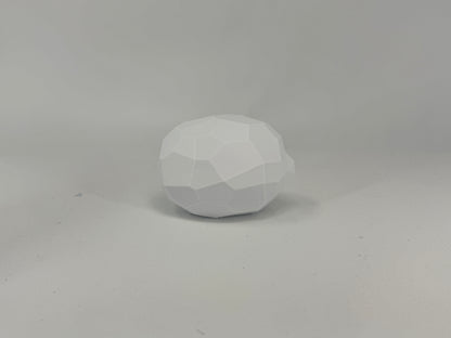 Faceted white planar lemon lying on its side